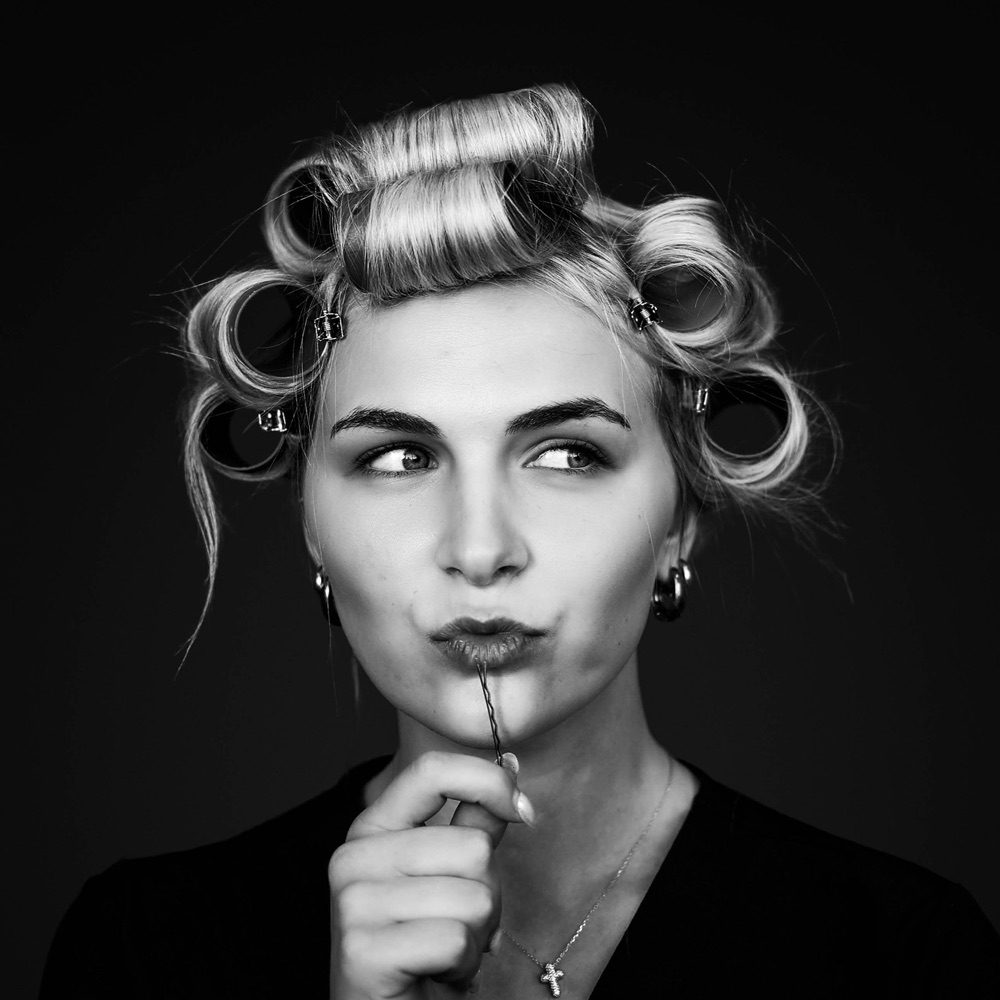 Student styling hair at City Pointe Beauty Academy